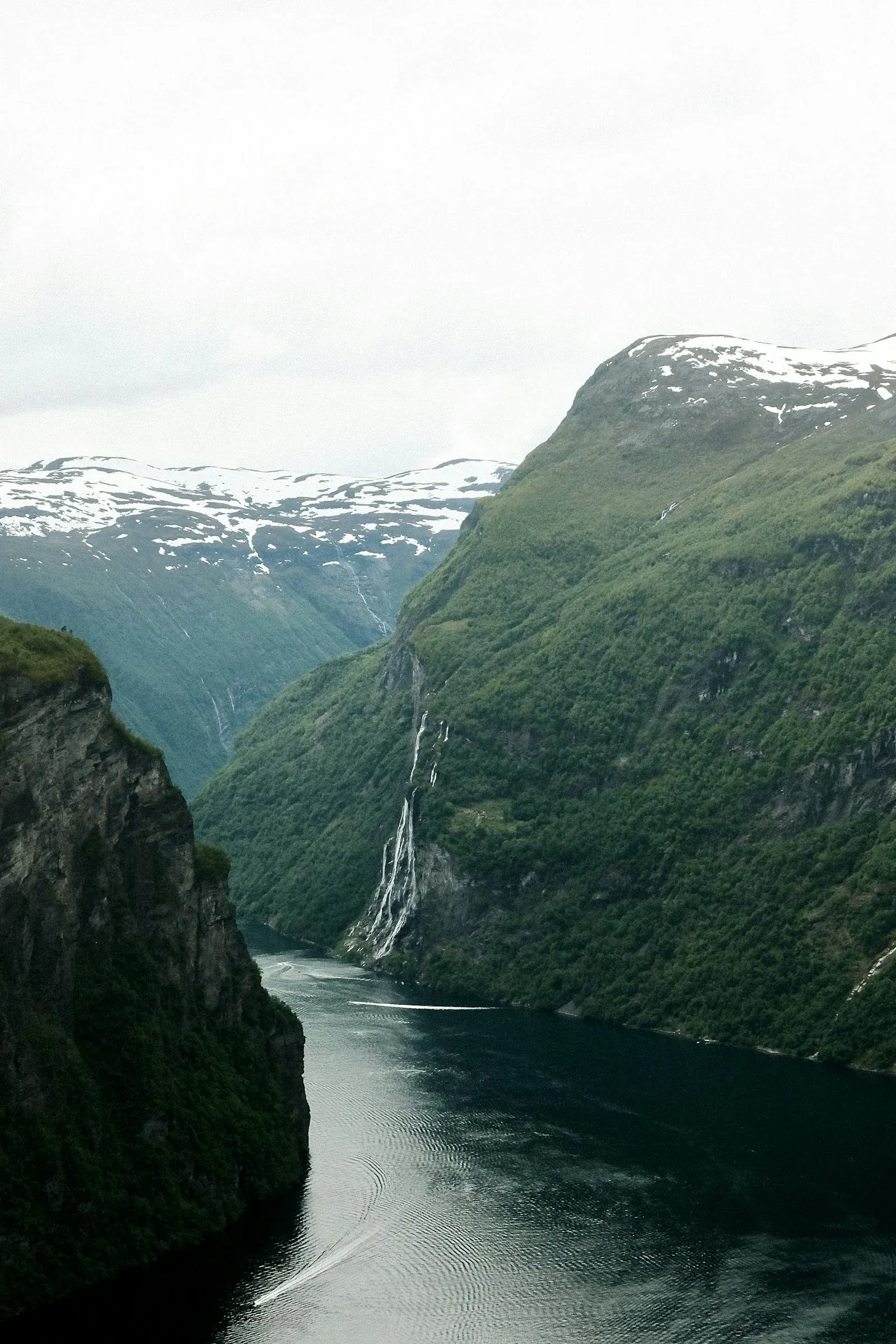A fjord between towering Norwegian mountains